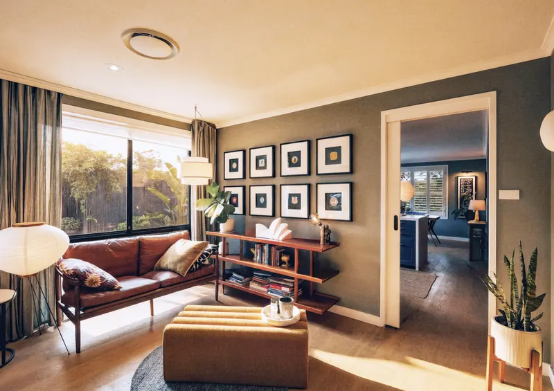Second lounge with leather sofa and gallery wall